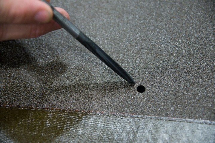 AMAMCO diamond-coated drilling tool next to hole drilled in F-35 skin
