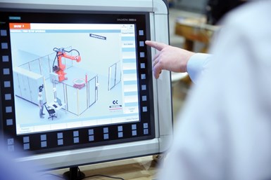 A photo of people using Siemens' Run MyRobot program, which adds precise control to Ingersoll's robotic machines.