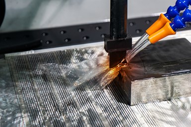 A stock photo of an EDM machining using a graphite electrode