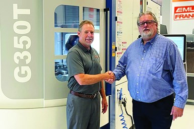 Emuge-Franken USA’s president Bob Hellinger (L) and Grob’s key account manager Kevin Gadde (R) shake hands.