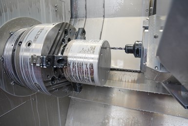 A photo of the M30's spindle being soaked with coolant while in use
