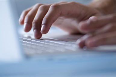 A stock photo of a person typing