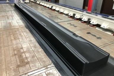 A photo of the 22-foot-long vacuum trim tool after its 3D printing, but before its machining