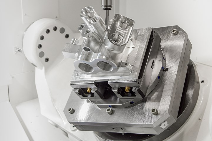 A 6061 aluminum pump housing undergoes five-axis machining operations on a Variaxis i800 Neo from Mazak. 