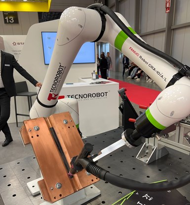 A photo of a Technorobot-branded FANUC cobot performing marking