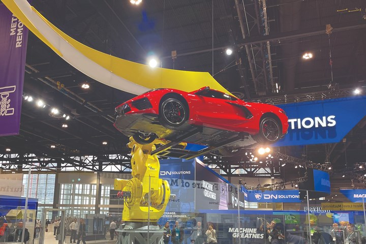 FANUC M-1000iA Large Payload Handling Robot lifting a Corvette on the IMTS 2022 Show Floor. 