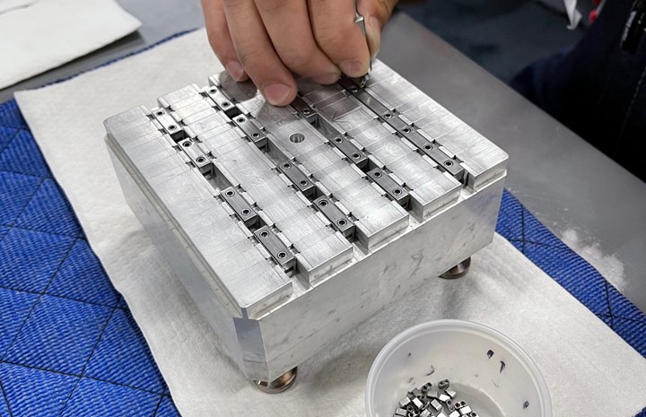 Pallet holding machined satellite connectors