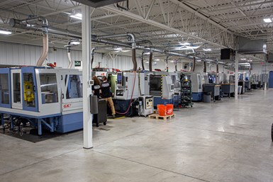 A photo of a row of Anca machines in Gorilla Mill's facility