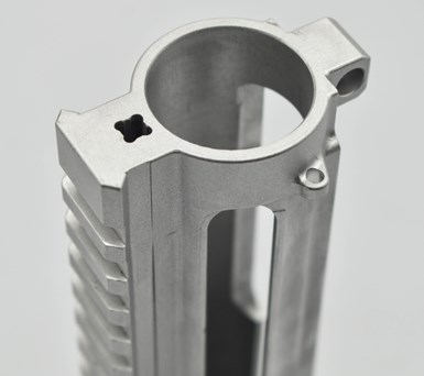 A photo of a prototype gun part, as machined by NTL Industries