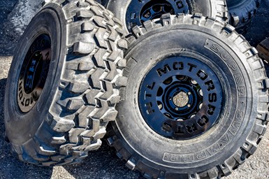 A photo of two Jeep tires with NTL Motorsports' prototype rims at their center.