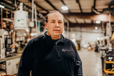 A photo of RPM Tool owner Matt Robbins standing in his combined facility.