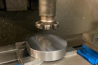 A photo of Tungaloy's Do-Triple Mill above a workpiece