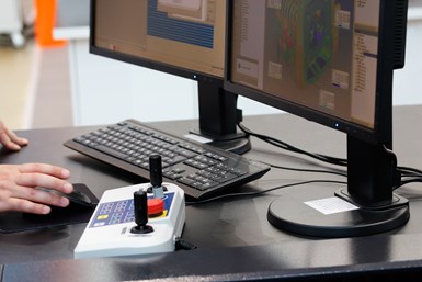 A person working in a CAD/CAM file