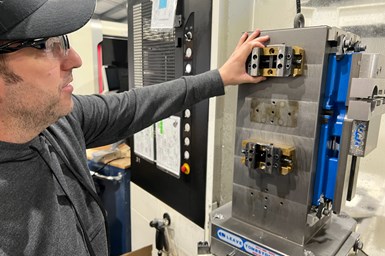 Luke McKenzie demonstrating the vertical workholding fixtures on one of his HMC's pallets.