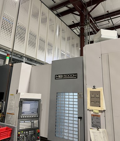 One of BDE's Okuma MB-5000H machines connected to the shop's Fastems flexible machining system