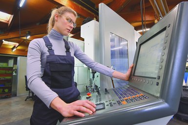 An operator at a machine control