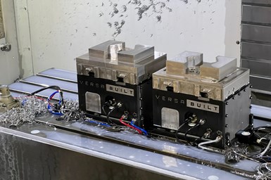 VersaBite vises and jaws on a vertical three-axis machine's table.