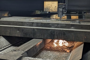 Laser cutter in action cutting through metal at CVC