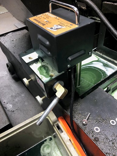 A photo of a skimmer removing oil from coolant