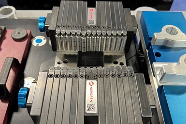 Norgren's Adaptix grippers on top of a Jergens vise.