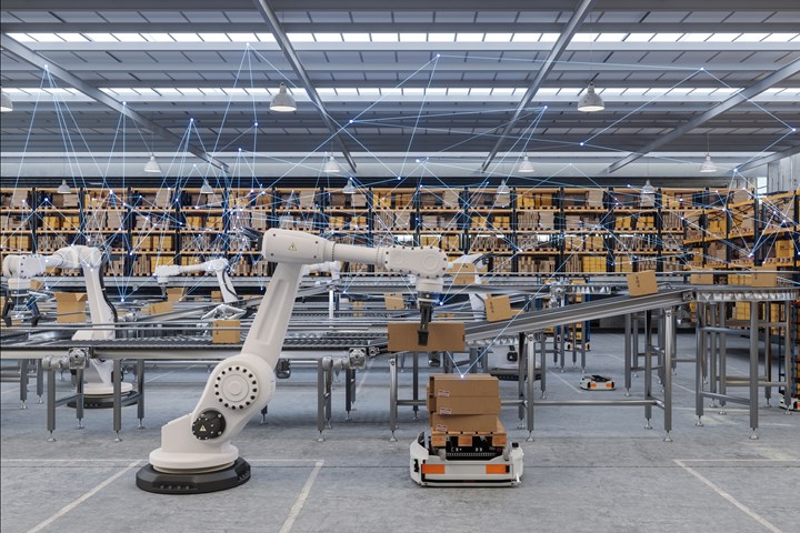 Robots working with AMRs in a warehouse