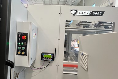 The master control unit of a Vektek Guardian 2.0 system attached to the outside of a DN Solutions LPS 5000 pallet system