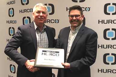 Fred Braun (left) of Braun Machinery receives the 2021 Top Net Revenue Award from Cory Miller, Hurco North America general manager. 