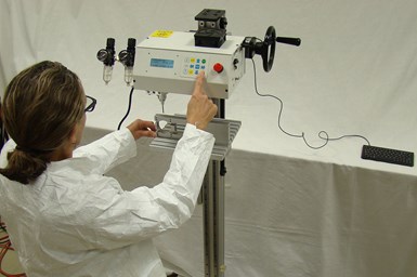 A photo of an operator using the Kwik Mark full column option of one of its dot peen markers