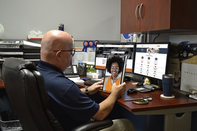 Rich Wozniak virtually consulting with a customer from his desk. 