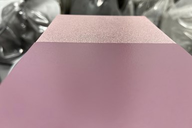 Photo of two panels, light pink with speckles and darker pink, showing before and after of recycled powder coating