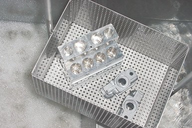 clean machined parts in a basket