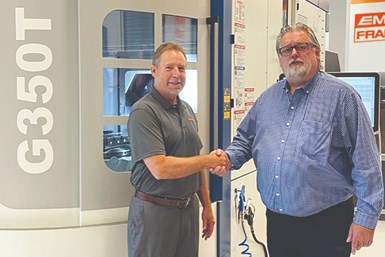 (left to right) Emuge-Franken USA President Bob Hellinger and Grob Key Account Manager Kevin Gadde stand in front of the Grob G350T 5-Axis mill-turn machine installed at the Emuge-Franken USA Technology Center in West Boylston, Massachusetts.