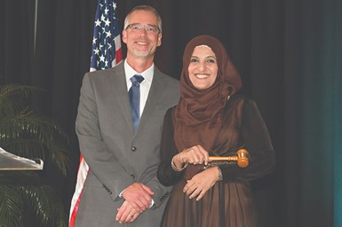 Tom Halladay poses with Aneesa Muthana after handing her the president’s gavel at the PMPA Annual Meeting 2021.