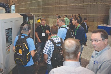 Attendees learning from exhibitors and other attendees at IMTS.