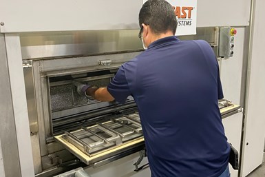 operator working on CTG rotary parts washer
