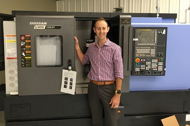 Wes Wolfenbarger stands at his Doosan Lynx 220