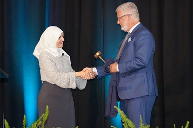 Aneesa Muthana hands the President’s Gavel to John Habe IV at the  PMPA Annual Meeting 2022.