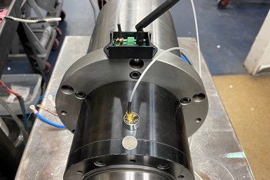 Shown here is a spindle with VibePro Tect installed, 3-Axis sensor and wireless transmitter which transmits collected data to the web app. Photo Credit: GTI Spindle