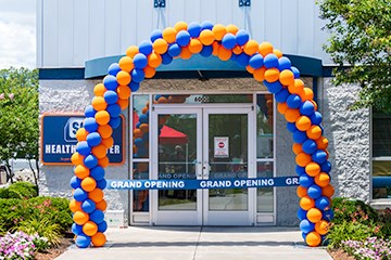 SCM health center exterior with balloons during grand opening