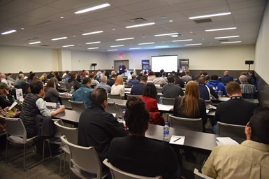 Parts Cleaning Conference attendees viewing presentation