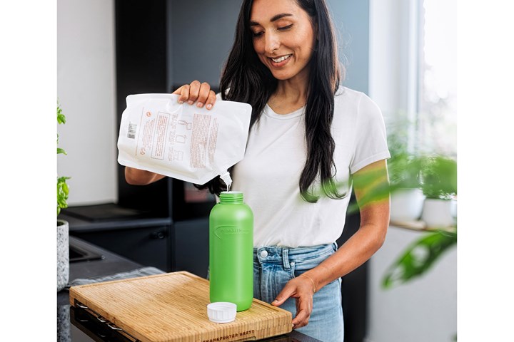 Borealis is displaying an extrusion blow molded PP bottle made from waste and recycled vegetable oils, which has a green solid exterior, white solid interior, and foamed middle layer produced with Trexel’s MuCell technology.
