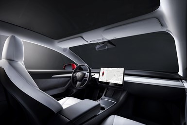 Tesla has had multiple effects on auto manufacturing, including in the interior, where the traditional knobs and buttons have been eliminated, as in this Model 3. Photo Credit: Tesla