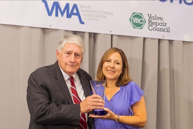 Ron Warren receiving membership award from VMA president Heather Rhoderick.