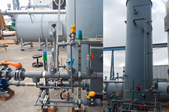 A photo of a series of pipes and tubes coming off a stack, controlled with a variety of valves and regulators. for pollution abatement.