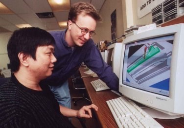 CAM programmers Tin Nguyen, left, and Ed Mueller