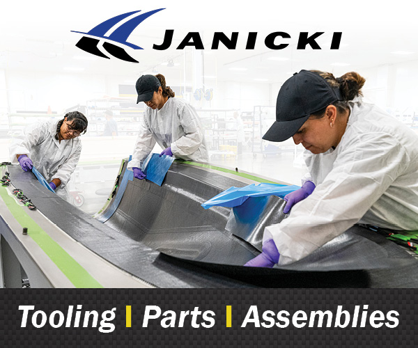 Janicki employees laying up a carbon fiber part