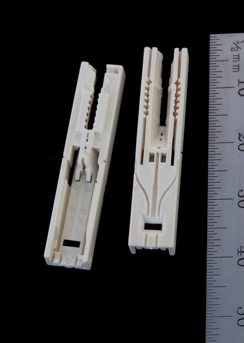 Small plastic components of precise surgical tool. 