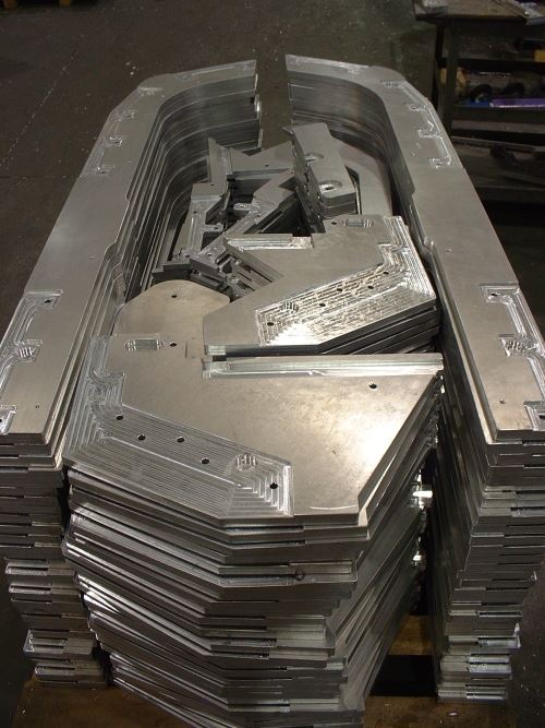 multiple components machined from an aluminum plate